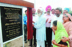 Noted environmentalist Sunderlal Bahuguna inaugurates water treatment plant.