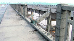 A signboard prohibits pedestrians against using the footpath on Satluj bridge near Ludhiana.