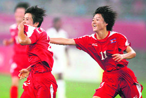 Hwa Kim Kyong (C) of North Korea celebrates after scoring a goal during the 2008 Beijing Olympic Games first round women football match against Nigeria at the Shenyang Olympic Stadium on Wednesday. North Korea won 1-0. 