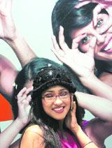 Actress Rituparna Sengupta poses with a pair of Titan spectacles after inaugurating a showroom namely Titan Eye+ in Kolkata on Wednesday.