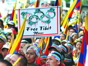 Activists of the Tibetan Youth Congress hold a protest rally against China on the eve of the opening of the Beijing Olympics at Jantar Mantar in New Delhi on Thursday. 