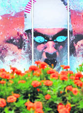 A giant poster near the Olympic Green, the Olympic compound in Beijing, shows US star swimmer Michael Phelps in action.