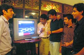 Sports lovers watch the opening ceremony of Beijing Olympics in Chandigarh