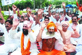 Activists of Shri Amarnath Yatra Sangharsh Samiti protest outside the house of Congress MP Rana Gurjit Singh in Jalandhar on Friday.
