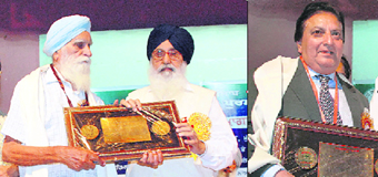 Chief Minister Parkash Singh Badal felicitates Jaswant Singh Kanwal with Punjabi Sahit Rattan Award, 2007, and (right) Fakhar Zaman from Pakistan with the Shiromani Punjabi Sahitkar Award (Videshi), 2008, at a function organised at Panjab University, Chandigarh, on Friday.
