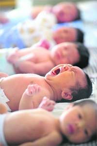 New-born babies are seen at a hospital in Hefei, Anhui province, on Friday, the opening day of Beijing Olympics. New-born babies in China are paying the penalty for their parents' patriotic fervour, with thousands named after the five mascots of the Beijing Olympics.