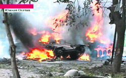 A Russian Channel One television grab shows a Georgian tank burning in Tskhinvali on Friday. Russia's defence ministry said more than 10 of its troops deployed as peacekeepers in South Ossetia have been killed in Georgian offensive in the breakaway region,