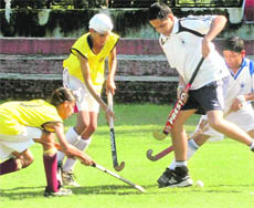Players in action during the first semifinal of Chandigarh State Hockey Championship between Rock Rovers and St Stephens School at Hockey Stadium, Sector 18, Chandigarh, on Saturday. 