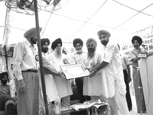 Punjab cooperative minister Captain Kanwaljit Singh during the inauguration of a bank  branch at Chunni Kalan village, Fatehgarh Sahib, on Saturday.