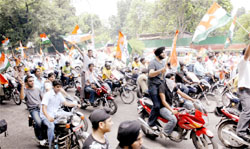 Indian Youth Congress members participate in a motorcycle rally from AICC headquarters to Rajghat in New Delhi