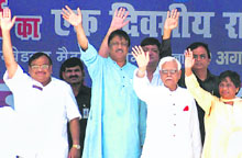 Uttar Pradesh Chief Minister Mayawati (extreme right), former foreign minister Natwar Singh and Shahid Siddiqui wave at the crowd during the BSP national workers meet in Lucknow on Saturday.