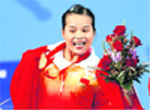 Chen Xiexia of China poses with her gold medal for the womens 48kg Group A weightlifting competition at the Beijing 2008 Olympic Games