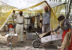 Honey being extracted from beehives in a makeshift workshop near Pathrala on the Bathinda-Dabwali road.