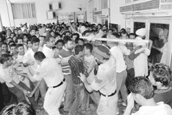 Policemen lathicharge the public during the second show of Singh is Kinng at Tagore Theatre in Patiala 