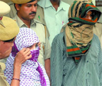 The couple held for stealing a womans debit card in New Delhi on Sunday.