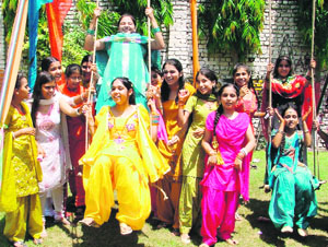 Students take part in Teej celebrations at Shivalikwala Doon School in Ludhiana. 