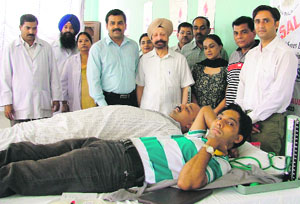 Volunteers donate blood at the seventh monthly blood donation camp organised by Salaam Zindgi in Ludhiana on Sunday. 