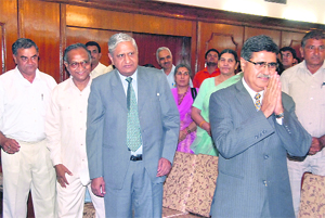 Bharat Bhushan Batra (with folded hands), acting chairman of the Haryana Public Service Commission, with his colleagues (on his right) R.D. Sheokand, M.P. Bidlan and Prem Prakash after they were sworn in by Governor A.R. Kidwai in Chandigarh on Monday.