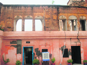 This damaged building houses the city police station.