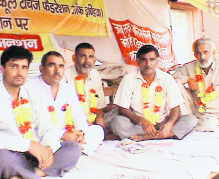 Schoolteachers sit on a dharna in Jind.