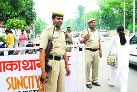 Policemen guard a naka in Jhajjar.