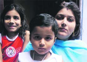 Vansh (centre), who was beaten up in Jammu for violating the curfew
