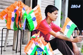 A vendor sells Tricolours ahead of the Independence Day in Jammu