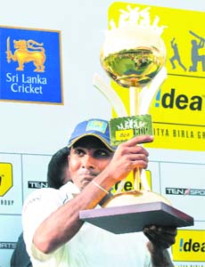 Mahela Jayawardene holds the winners trophy after their victory in the third Test between India and Sri Lanka at The P. Saravanamuttu Stadium in Colombo