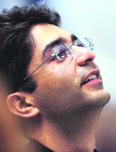 Abhinav Bindra looks up at the scoreboard as he wins the men's 10m air rifle shooting competition at the Beijing 2008 Olympic Games