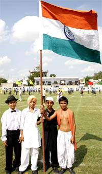 While the Hindu and Muslim population in Jammu and Kashmir is divided on the Amarnath land issue, the tiny-tots in Bathinda portraying the Hindu, Muslim, Sikh and Christian religions, hold the tricolour aloft on Tuesday during the final rehearsal for the Independence Day celebrations.