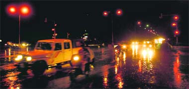 Motorists drive through rain in Chandigarh