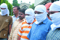 Five members of an interstate highway robbery gang held by the crime branch in New Delhi on Tuesday.