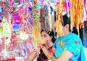 With Raksha Bandhan round the corner, women select rakhies in a market in Sonepat