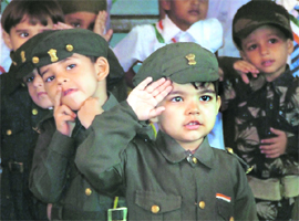 Schoolchildren of Disney Land salute the tricolour at a function to celebrate the Independence Day in Ludhiana on Tuesday.