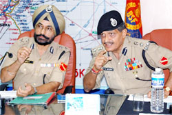 Punjab frontier inspector-general Himmat Singh (left) shares a point with DIG V.K. Sharma during the workshop in Abohar 