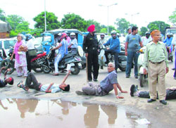 VHP activists block traffic on the Madhya Marg in Chandigarh on Wednesday. 
