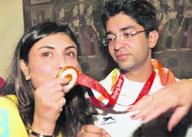 THE HERO RETURNS: Olympian gold medallist shooter Abhinav Bindra with his sister on his arrival at IGI Airport in New Delhi on Wednesday night