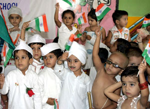 Tiny-tots perform during a function organised on the eve of the Independence Day at the Kids Care, a play school, in Bathinda on Thursday. 
