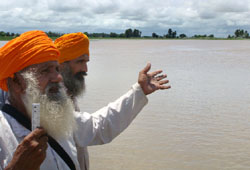 Natures fury: Desa Singh, a farmer, showing his fields that have been flooded in Bandala village.
