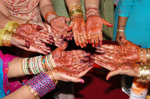 Girls show the henna designs on their hands in Ferozepur.