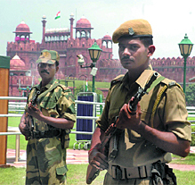 Securitymen keep a vigil on the Red Fort on the eve of Independence Day in New Delhi.