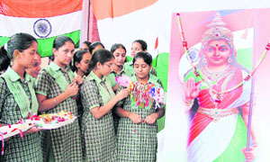 Students of Green Land Senior Secondary Public School tie Rakhi to the idol of Bharat Mata in Ludhiana.