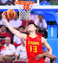 Yao Ming of China grabs a rebound over Joaquim Gomes of Angola during their Group B men's basketball game at the Beijing 2008 Olympic Games