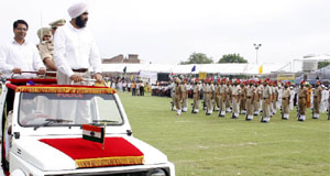 Punjab finance minister Manpreet Singh Badal inspecting the guard of honour at the sports stadium in Bathinda on Friday.