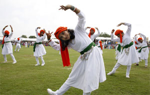 Schoolchildren presenting a cultural programme on the occasion.