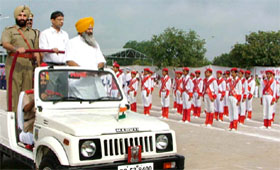 Sucha Singh Langah, agriculture minister, Punjab, (left) inspects the guard of honour at Muktsar