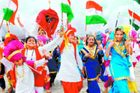 Jubilant students of KB DAV School, Sector 7, Chandigarh, after bagging the first position in the cultural programme during the Independence Day function at Parade Ground on Friday.