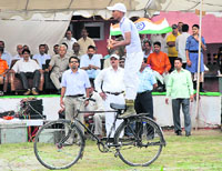 A youth participates in the Independence Day celebrations at Karan Stadium in Karnal on Friday.