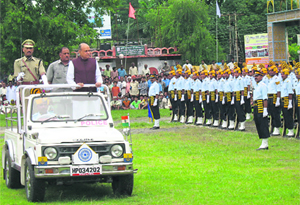 Chief Minister P.K. Dhumal inspects the parade at the state-level Indepen- dence Day function at Paonta on Friday.