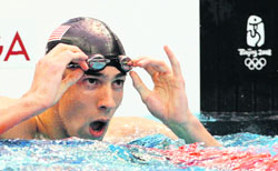 Michael Phelps of the USA looks at the scoreboard after swimming in the men's 200m individual medley final at the National Aquatics Centre during the Beijing 2008 Olympic Games on Friday. 